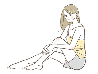 足をマッサージする女性