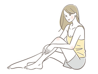 足をマッサージする女性