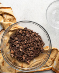 Overhead view of chopped dark chocolate for baking, top view of chocolate chunks