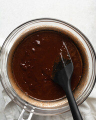 Fototapeta premium top view of dark chocolate ganache being melted in a double boiler 