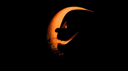 Naklejka premium Silhouette of a pumpkin head on Halloween with a crescent moon.