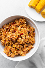 Overhead view of tomato scrambled eggs, top view of egg fried in tomato sauce