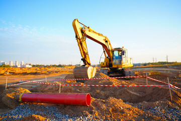 Excavator earthworks on construction site.  Sewer Line Repair. Excavator groundwork Water Line...