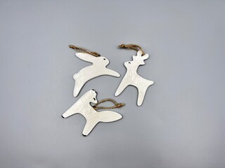 Christmas decorations ceramic animals deer hare fox in Scandinavian minimalist style top view on light background
