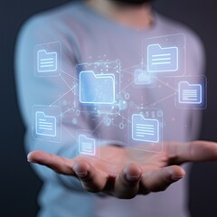 Close up of a man's hand presenting a glowing digital interface showcasing organized files and data connections within a futuristic abstract network