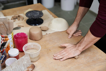 Creating unique pottery pieces in a vibrant studio setting