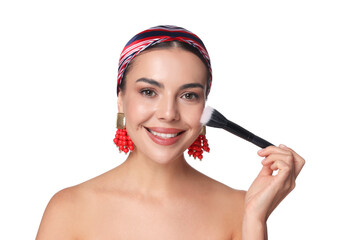 Beautiful woman applying makeup with brush on white background