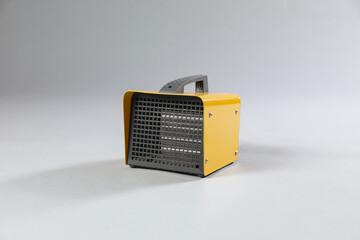 One electric fan heater on grey background