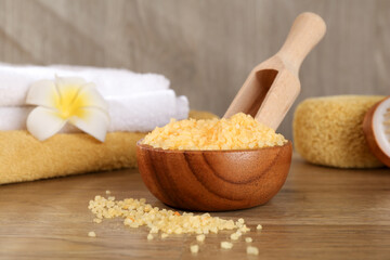 Natural sea salt on wooden table, closeup