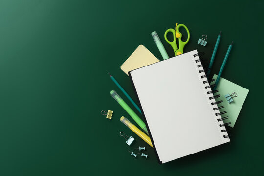 Happy teacher's day. Blank notebook and stationery on green background, flat lay. Space for text - Powered by Adobe