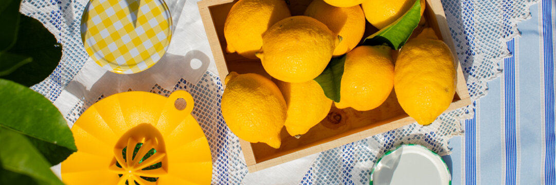 Sun-kissed lemons on rustic lace evoke summertime soirees or La Tomatina zest amidst tranquil countryside mornings