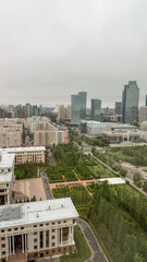 Gray cityscape under brooding skies echoes urban solitude, linking International Workers' Day to...