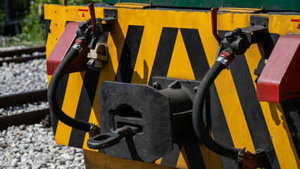 Railway junction's vibrant brake hoses, industrial dance of mechanics, celebrates National Train...