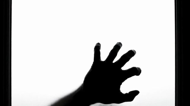 black-and-white cinematic sequence, depicting the emergence of a human hand pressing against frosted glass from the opposite side.