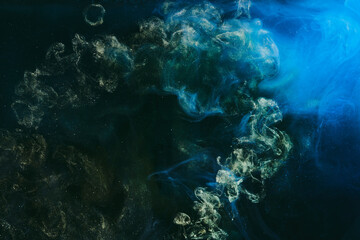 Abstract green blue background. Moving flow of multicolored paints, colorful fluid liquid art