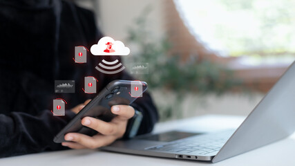 Cloud data breach concept showing a person using a smartphone and laptop with a hacker icon and warning symbols, representing cybersecurity threat, online attack, and data leakage risk.