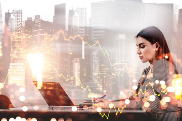 Focused woman working on laptop with financial chart overlay, modern creative style, glowing city skyline background, concept of data analysis