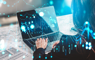 Businesswoman typing on laptop with glowing financial charts overlay, creative style on marble desk background, concept of digital data analysis