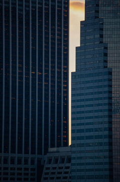New York, Usa: aerial view and skyline at sunset on Lower Manhattan with iconic skyscrapers, details of the 111 Wall Street, famous building in Financial District built in 1966 

