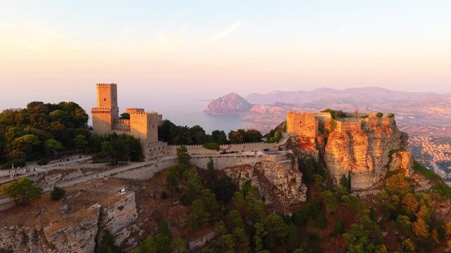 Old And Historic Castle of Balio And Castle of Venus During Sunset Overlooking The Mount Cofano By Tyrrhenian Sea In Sicily, Italy. - aerial shot