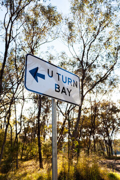 U turn bay sign with arrow in bushland at  Battery Rocks Rest Area on side of highway