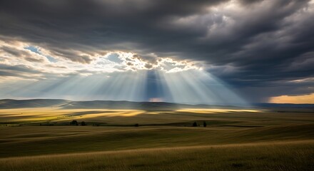 Dramatic rays of sunlight breaking through stormy clouds