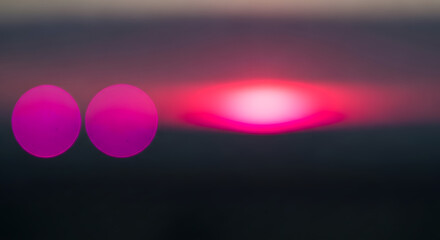 Abstract blurred sunset with pink and purple colors creating a soft and dreamy atmosphere with a sense of calm and tranquility