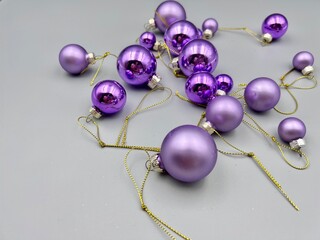 Christmas decorations scattered across the surface, close-up view from above, against a light background