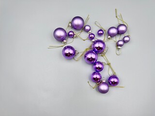 Christmas decorations scattered across the surface, close-up view from above, against a light background
