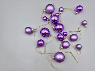 Christmas decorations scattered across the surface, close-up view from above, against a light background