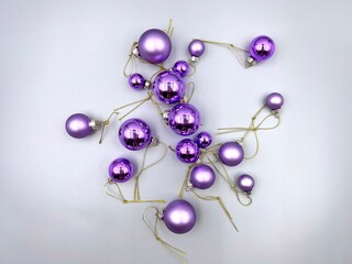 Christmas decorations scattered across the surface, close-up view from above, against a light background