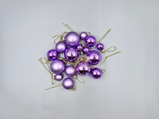 Christmas decorations scattered across the surface, close-up view from above, against a light background