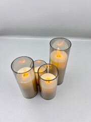 Electronic candles on a light background, Christmas decoration
