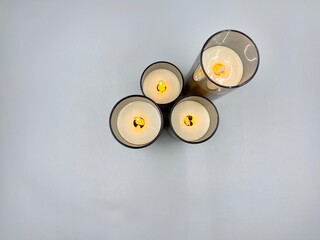 Electronic candles on a light background, Christmas decoration
