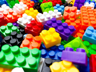 plastic toy blocks. Childrens building blocks construction, red. multi-colored children's plastic constructor on a white isolated background. Kids playing learning  