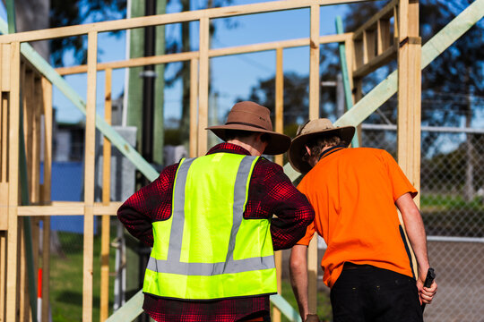 young aussie tradie apprentices working on building frame small project