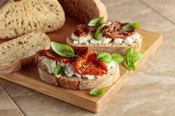Ciabatta with sun dried tomatoes in olive oil, ricotta, and basil.
