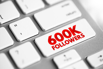600K Followers - reaching 600,000 followers on a social media platform or other online platform, text concept button on keyboard