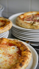 Traditional Italian pizza presented beautifully on a plate ready to be enjoyed in a restaurant