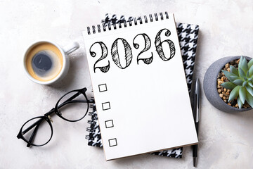 New year resolutions 2026 on desk. 2026 goals list with notebook, plant on colorful background. Resolutions, plan, goals, action, checklist, idea concept. New Year 2026 resolutions, copy space