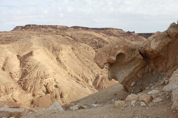 Rock formation in the sandy hills of Tunisia in a barren desert landscape without vegetation or trees