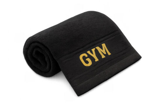 Black gym towel with gold lettering rolling up