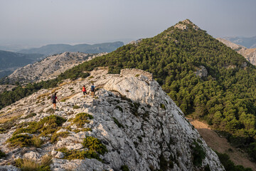 Fototapeta premium hiker on the three-thousand-mile route (tres mils), Sa Rateta-Na Franquesa-L'Ofre, Natural area of the Serra de Tramuntana., Majorca, Balearic Islands, Spain