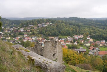 Ancient castle ruins overlooking picturesque village in bavarian forest