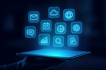 Hand holding tablet with glowing blue digital interface and APP icons against dark background 