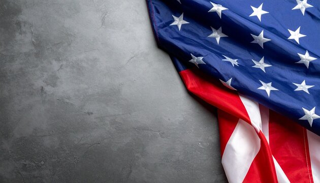 Partial view of U.S. flag draped diagonally across upper right corner on plain gray background.