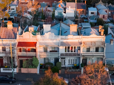 Aerial view of suburban terrace houses in golden afternoon light in West Melbourne in Victoria