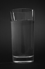 Water glass close up on a black background