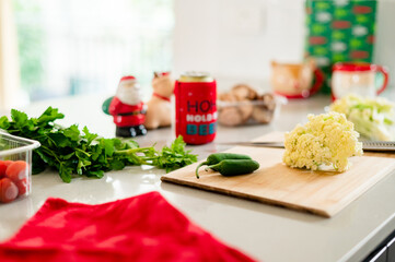 A vibrant kitchen filled with Christmas decorations and fresh ingredients for holiday cooking