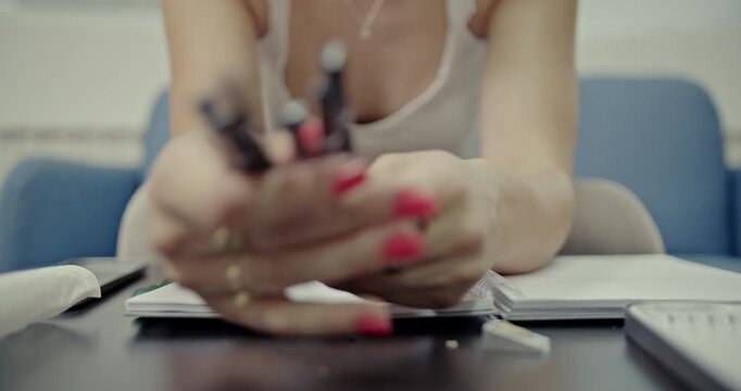 Experience the crisp sounds of a pencil being sharpened by a girl. This close-up footage captures the preparation for creative endeavors and artistic expression with auditory detail.